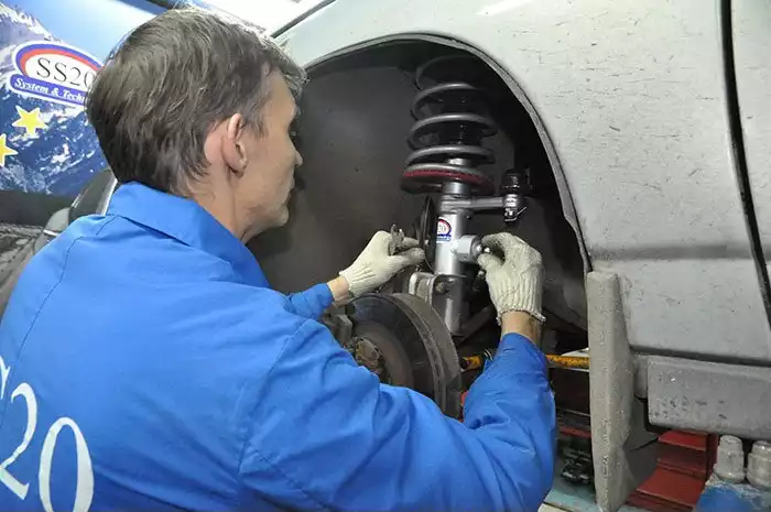 Repair (replacement) of a shock absorber in a car